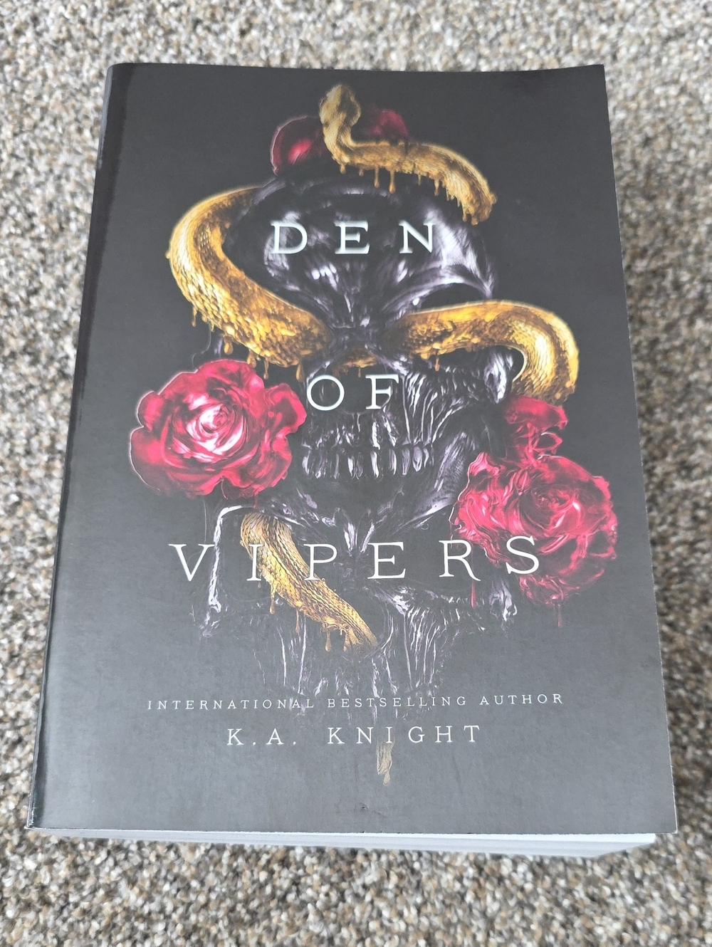 Den of Vipers Paperback Book - Black Cover with Gold Snake & Red Roses